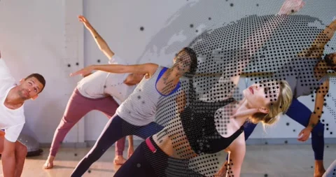 Instructor signaling side stretch in gym, group leaning sideways with guiding Stock Footage 318115103