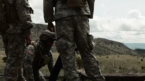 Instructor with soldiers on mortar range aiming mortar launcher. Stock Footage 52703056