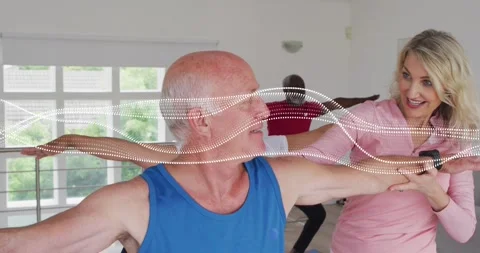 Instructor speaking and placing hands on... | Stock Video | Pond5