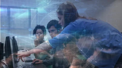 Instructor stepping in computer lab guiding students while network overlay Stock Footage 312280817