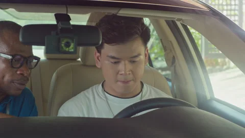 Instructor Talking to Student about Car Speedometer and Odometer Stock Footage 253058011