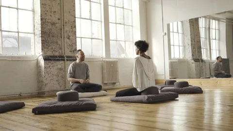 Instructor talking to the student in yoga class Stock Footage 112999061