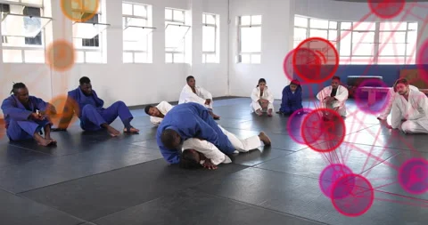 Instructor tapping partner to start jiu jitsu training with animated arrows Stock Footage 316134797