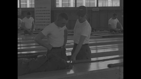 Instructor teaches how to pack the parachute - 1967 Stock Footage 118316136