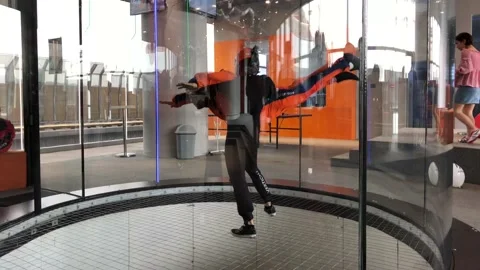 Instructor teaches indoor skydiving Stock-Footage 109322075