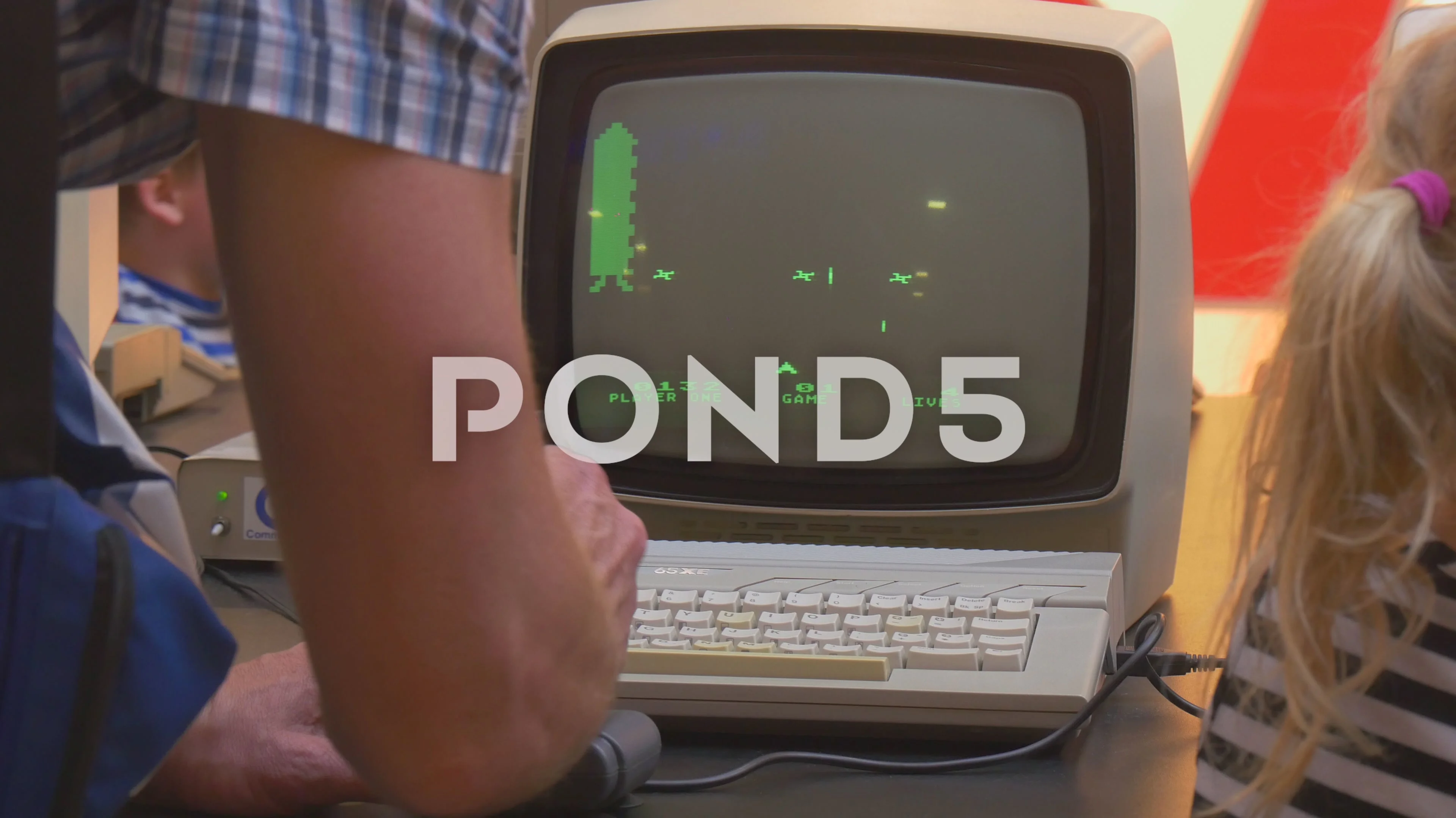 Instructor Teaches Kids to Play Old Comp... | Stock Video | Pond5