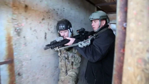 Instructor Teaches Trainee on Proper Doorway Approach Stock Footage 70562050