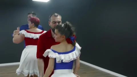 Instructor teaching bachata dance to students in studio 스톡 동영상 337216664