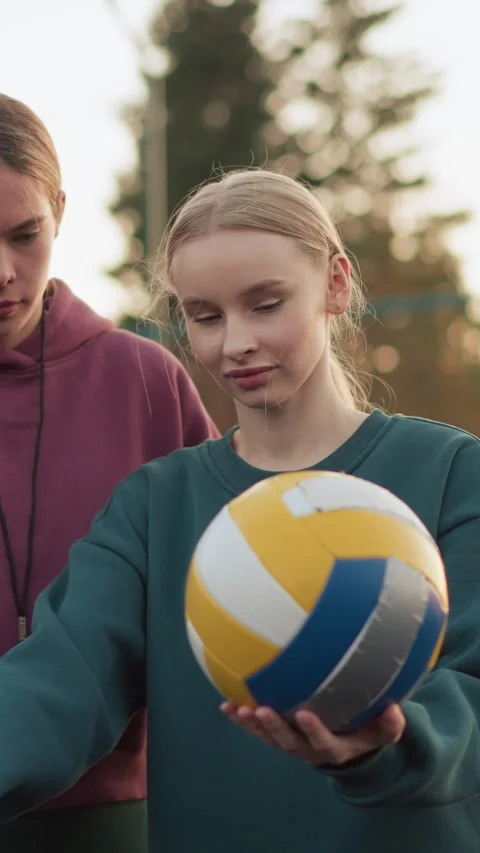 Instructor Teaching Beginner How to Serve Volleyball on Outdoor Court Video stock 319502584