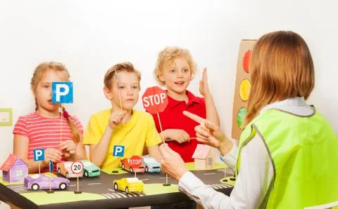 Instructor teaching a class of road traffic safety Stock Photos