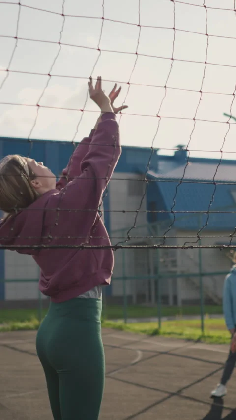 Instructor Training Beginner Volleyball with Two Players Watching in Outdoor Stock Footage 319485730