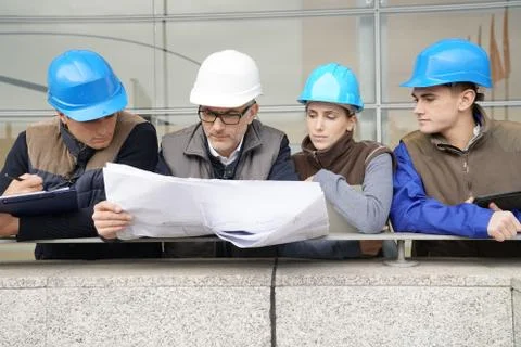 Instructor with young people in engineering training Stock Photos
