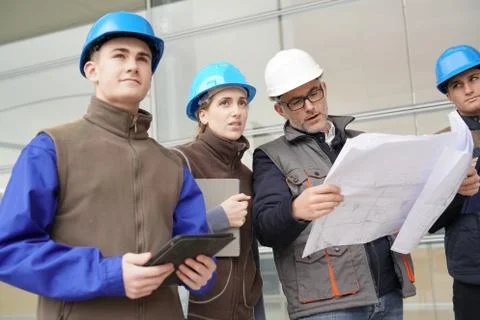 Instructor with young people in engineering training Stock Photos