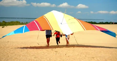 Instructors Launching Hang Glider, Sand Dunes, Gliding 4K Stock Footage 141561047
