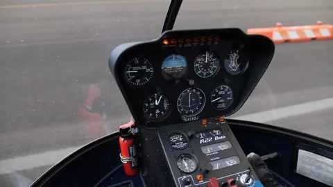 Instrument Panel and Helicopter Blade Spinning Up in Small Aircraft Stock Footage 114368989