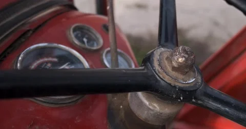 An Instrument panel and a steering wheel of an old and dirty farming tractor, 4k Stock Footage 142801804