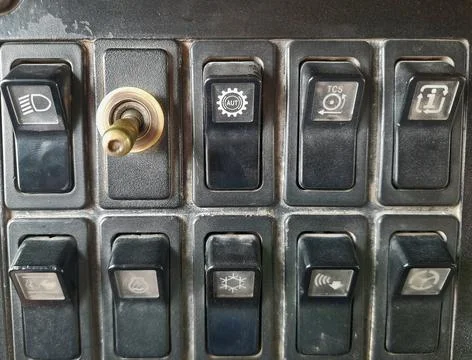 Instrument panel switch on the dashboard of a heavy equipment truck Stock Photos