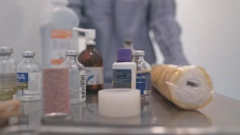 INSTRUMENTS AND MEDICINES TRANSPORTED BY A NURSE. Slow motion. Stock Footage 152496406
