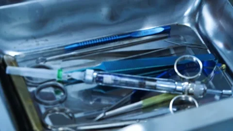 Instruments for the operation. Scalpel and scissors and syringes and needles and Stock Footage 145602620