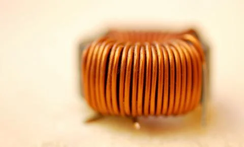 An insulated copper coil, inductive component that stores energy as a magnet Stock Photos