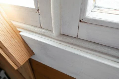 Insulated old window frames to prevent warmth heat leak and drafts, preparing Stock Photos