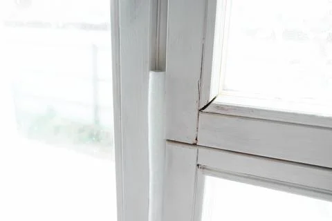Insulated old window frames to prevent warmth heat leak and drafts, preparing Stock Photos