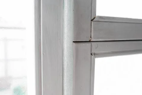 Insulated old window frames to prevent warmth heat leak and drafts, preparing Stock Photos