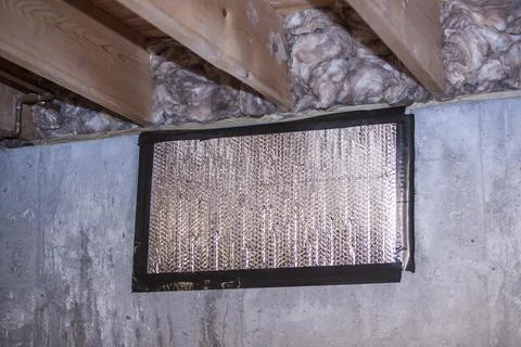 Insulated window that's in the basement. Stock Photos