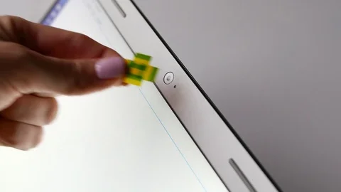 Insulating tape close laptop webcamera, spyware program anxiety Stock Footage 69879835