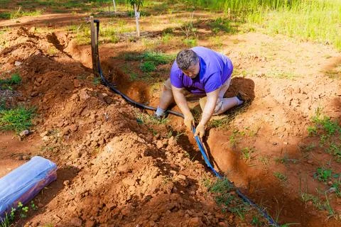Insulating water pipes is a common practice used to protect underground water Stock Photos