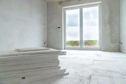 Insulation of floors with polystyrene on the construction site 스톡 사진
