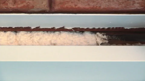 Insulation with foam for doors and windows Stock Footage 133617608