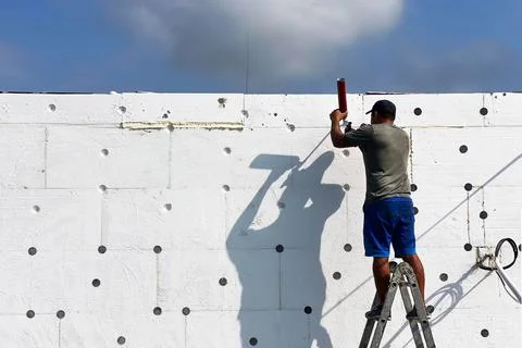 Insulation of the house with foam plastic, improving the quality of energy sa Stock Photos
