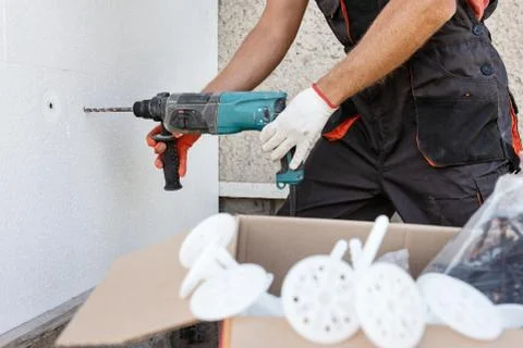Insulation of the house with polyfoam. Stock Photos