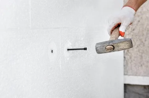 Insulation of the house with polyfoam. Stock Photos