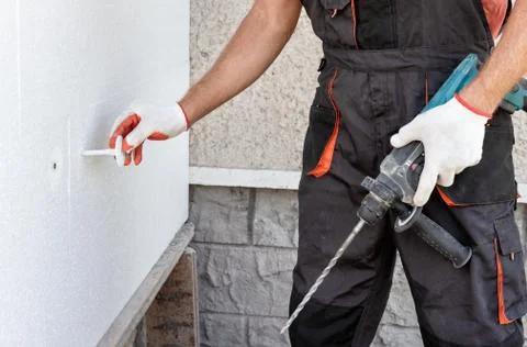 Insulation of the house with polyfoam. Stock Photos