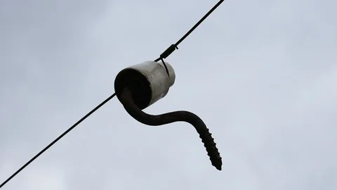 Insulation plug hanging on a wire Stock Footage 118308916