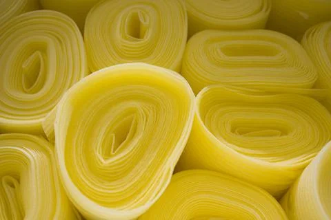 Insulation rolls in yellow packaging close up. Insulation construction mate.. Stock Photos