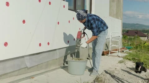 Insulation of the walls of the house with foam. Stock-Footage 208911060
