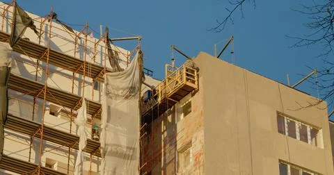 Insulation work in progress on an apartment building construction site Stock Photos