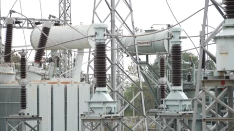Insulators attached to transformers at power station Видео 147859600