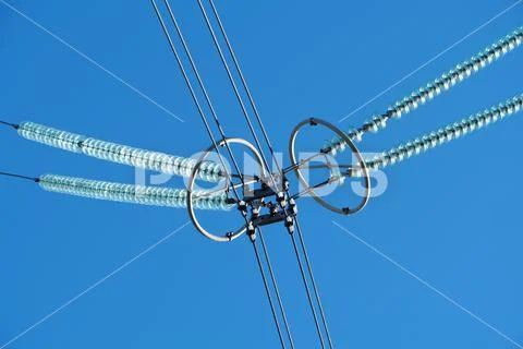Insulators on high voltage electric power lines Stock Image #162977261
