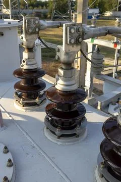 Insulators at a high voltage electrical substation. Stock Photos