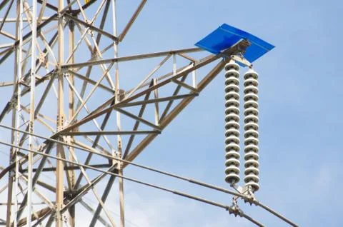 Insulators for securing power cables to high voltage electricity poles. On th Stock Photos