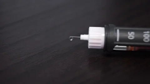 Insulin injection, needle, drop, 0.5 units of insulin Stock Footage 73545967