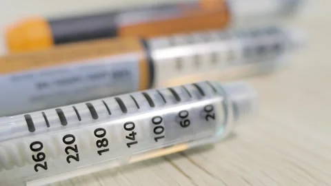 Insulin injection pens with clear dose scale close up Stock Footage 340237985