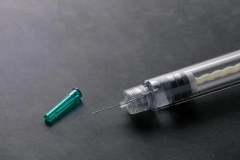 Insulin pen needle, threaded to attach securely and safely to insulin pen Stock Photos