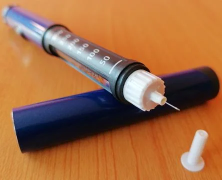 Insulin pen with needle tip, meter device and test strip for diabetics. Stock Photos