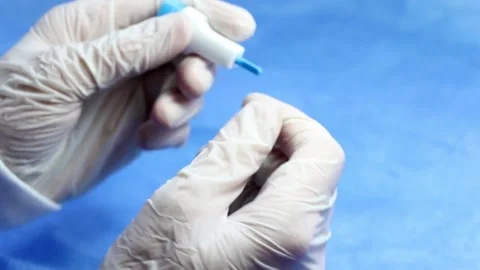 Insulin testing process, blood test and syringe. Injection in the hand. Patie Stock Footage 135394504