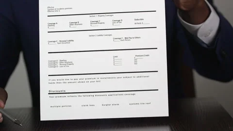 Insurance Agent Explains the Form Stock Footage 243600067